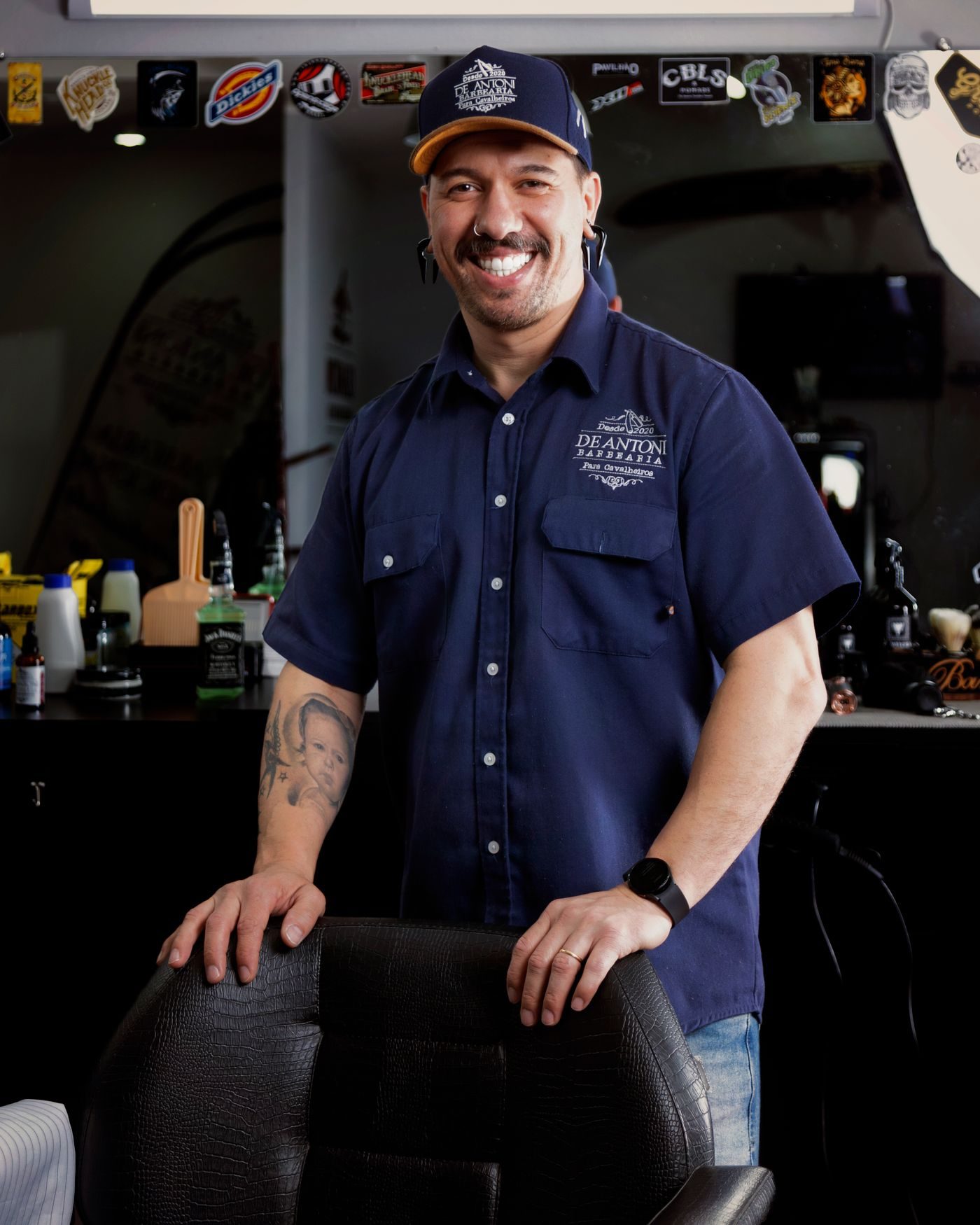 Barbershop owner in the doorway of his shop